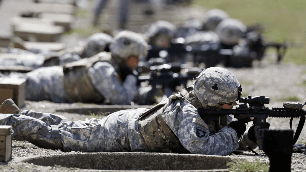 Girl in the military with gun